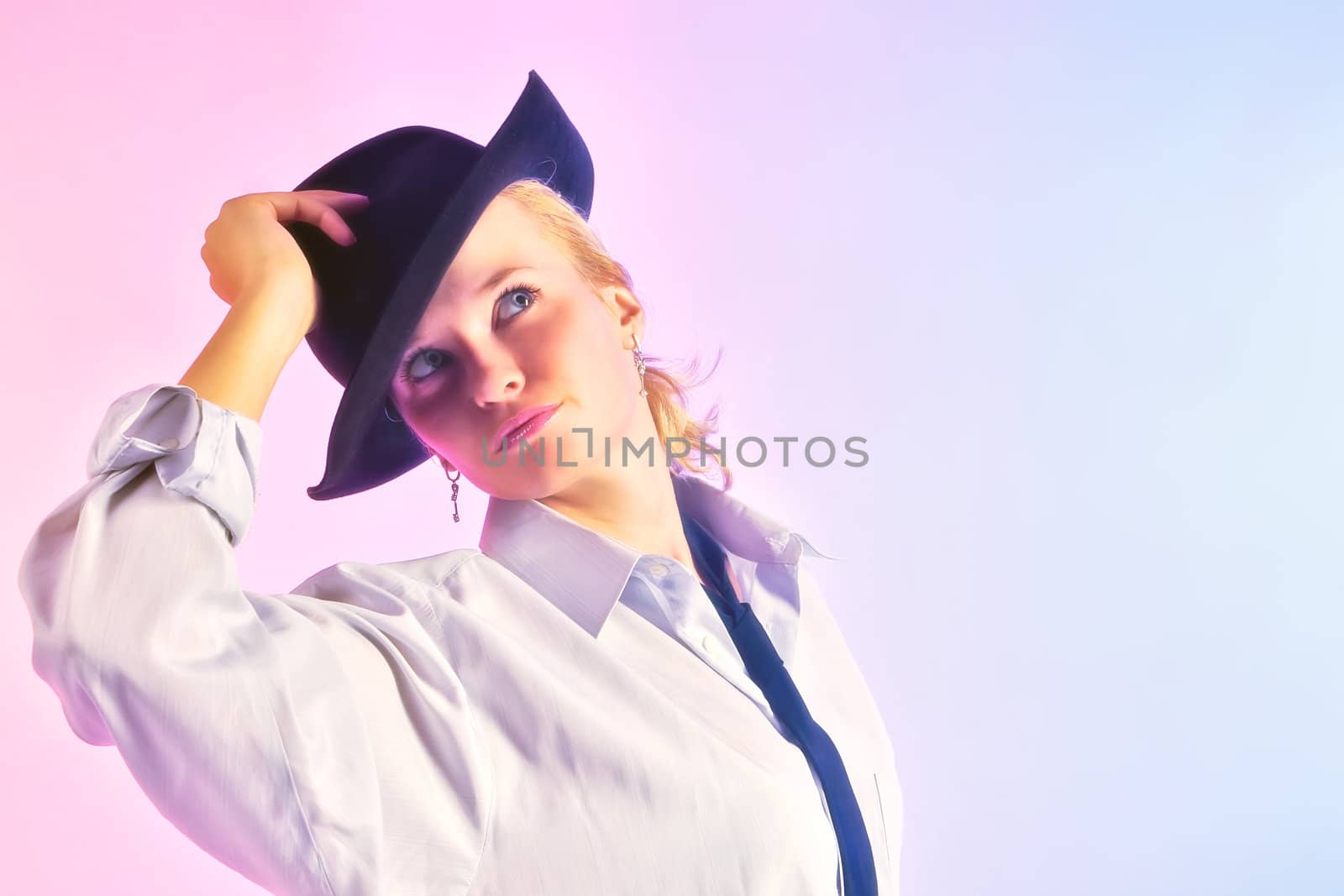 Portrait of young woman in a hat