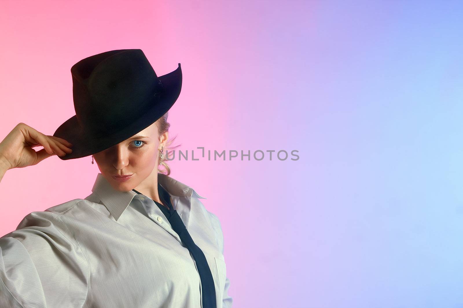 Portrait of young beautiful woman in a hat 