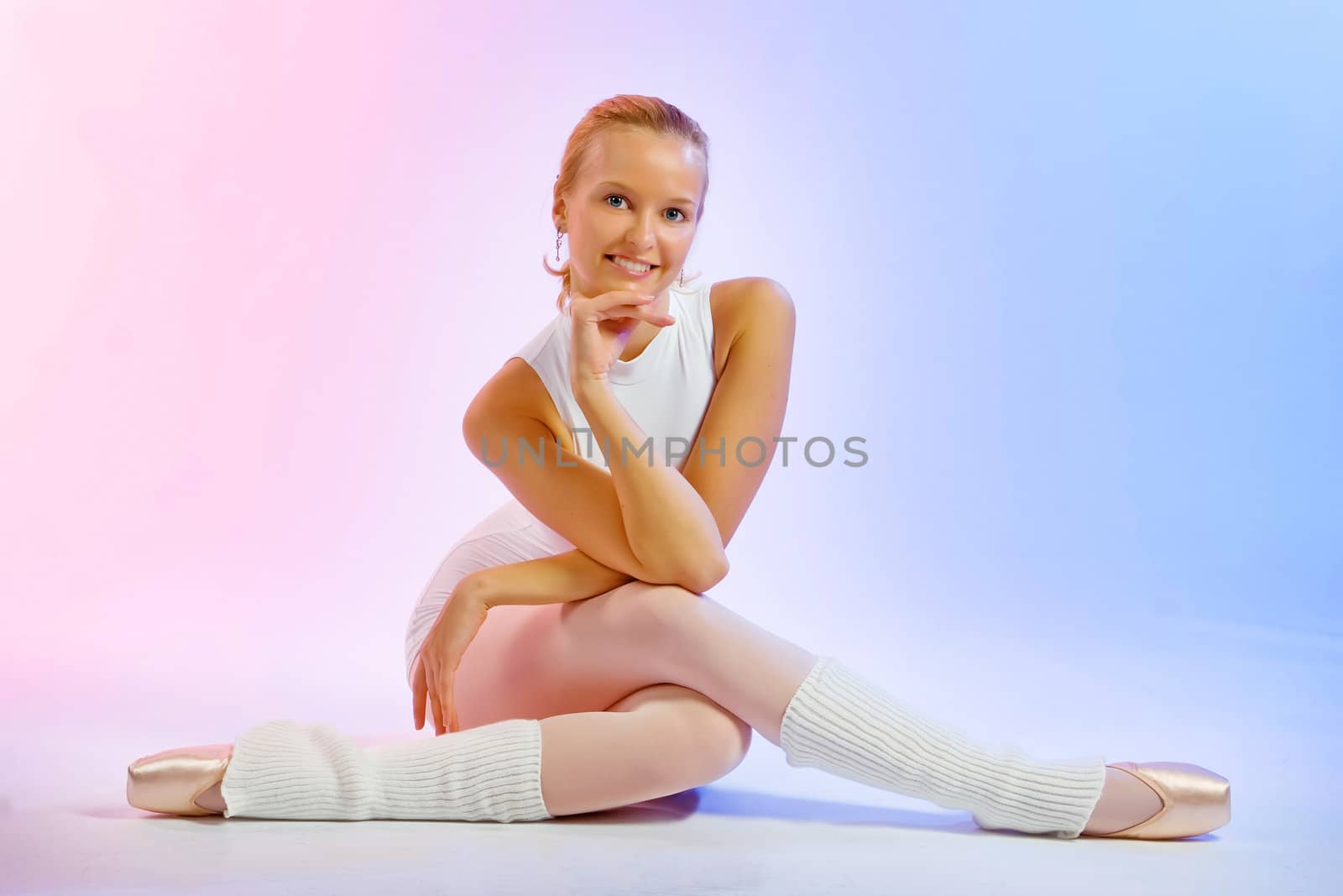 The charming young blonde during employment by fitness