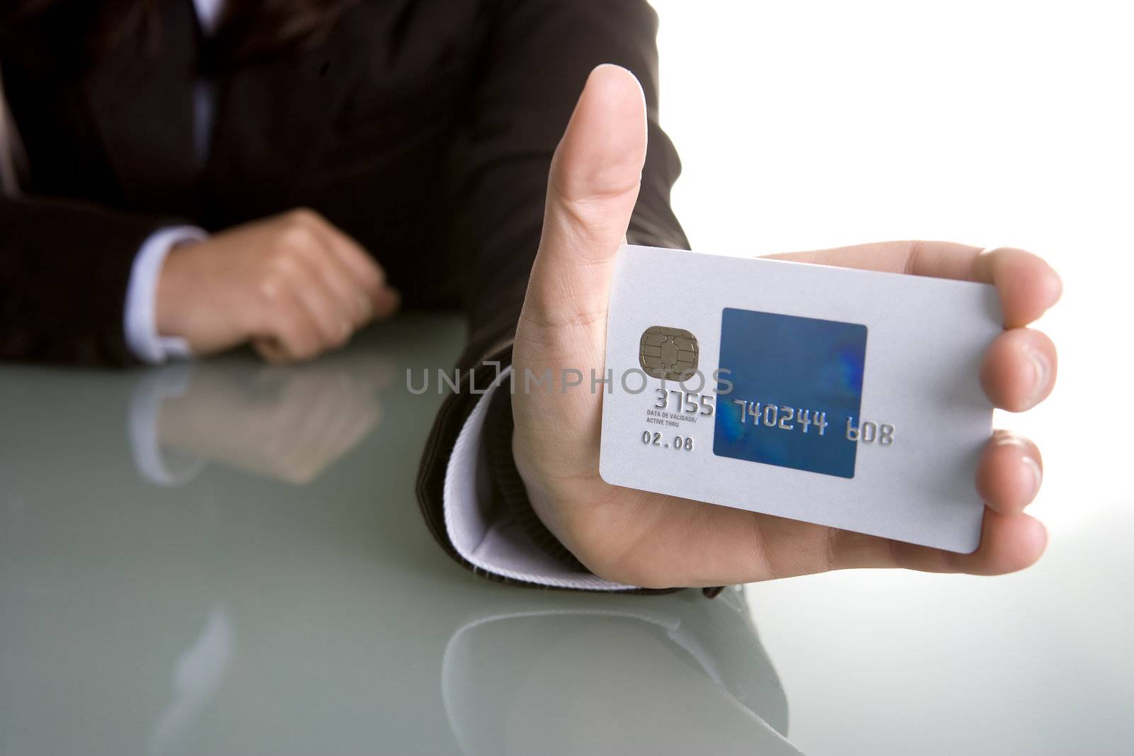 businesswoman holding credit card in the hand by mlopes