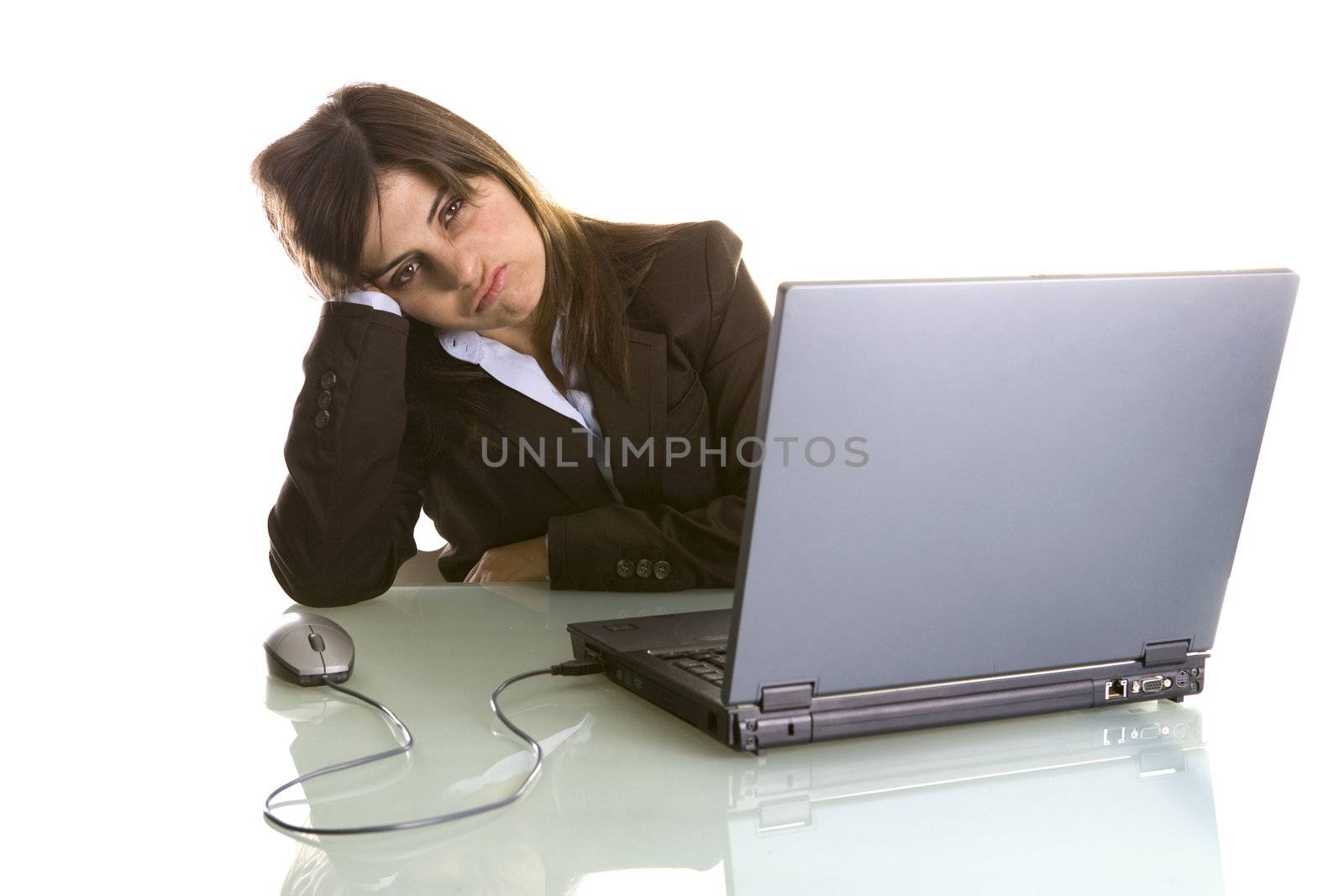 businesswoman with tired expression working with laptop computer isolated on white background