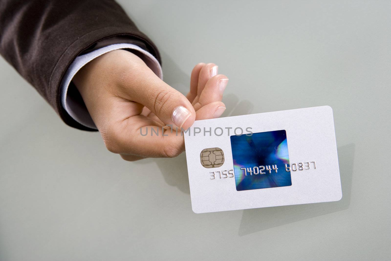 businesswoman holding visa credit card