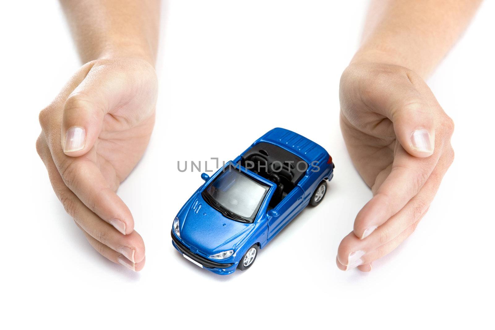 woman hands holding blue car isolated on white background