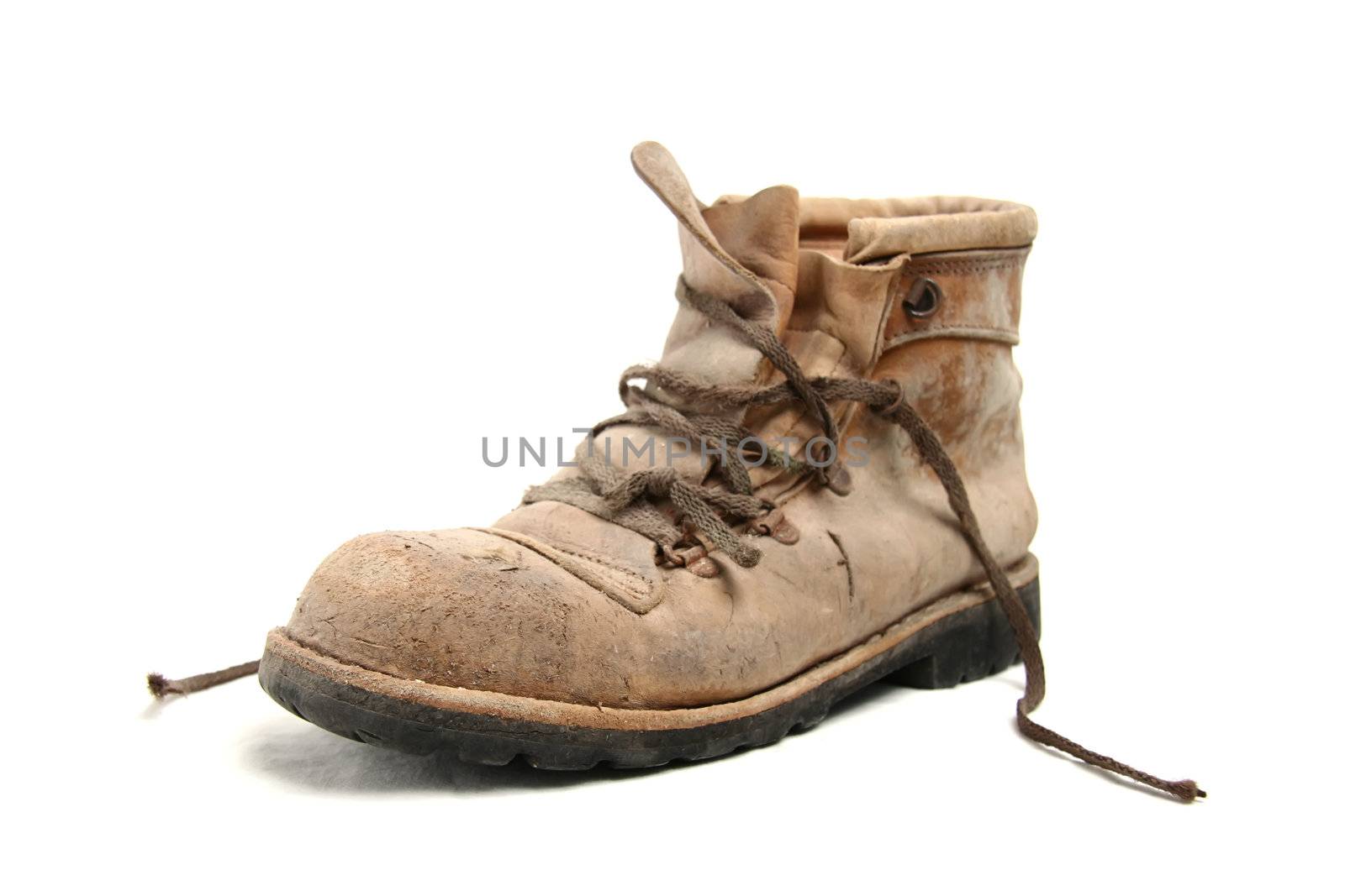 Dirty old brown pigskin leather work boot, very worn, with metal reinforcements to the sole