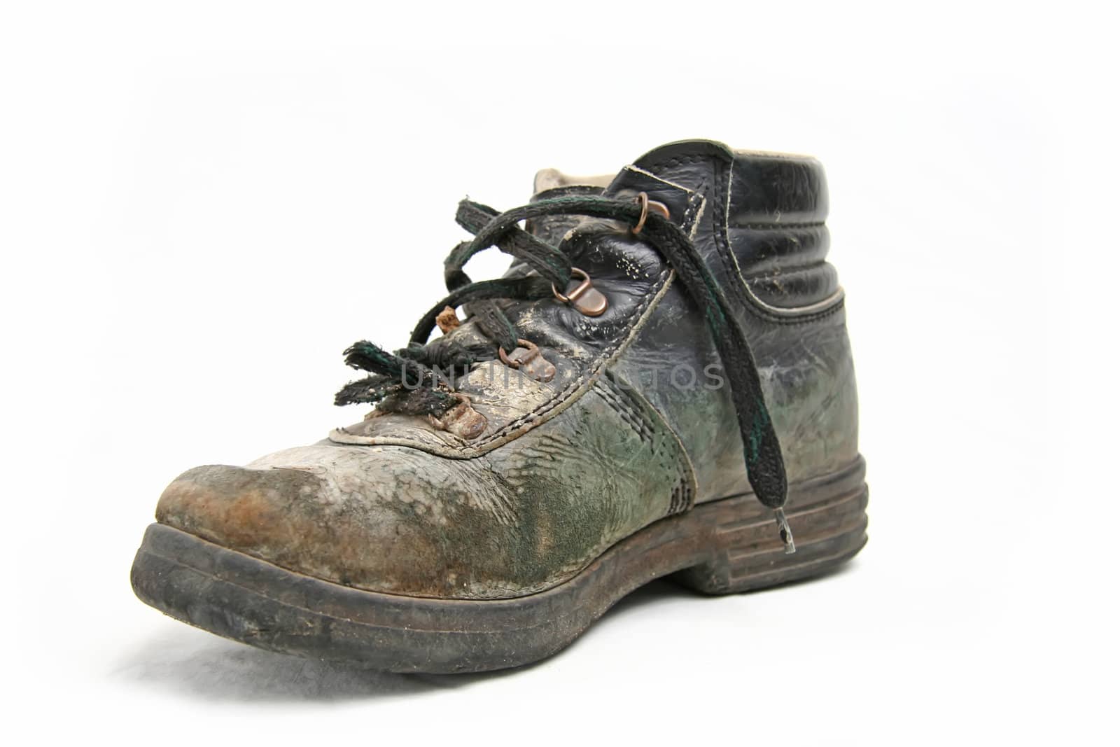 Dirty old brown pigskin leather work boot, very worn, with metal reinforcements to the sole