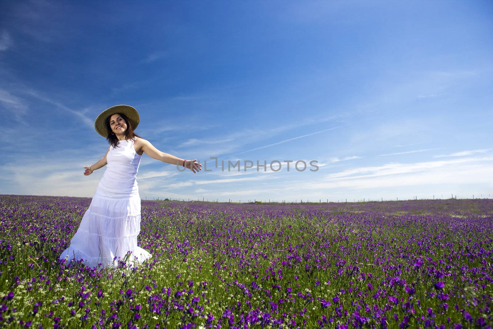 beautiful young woman in white dress enjoying nature