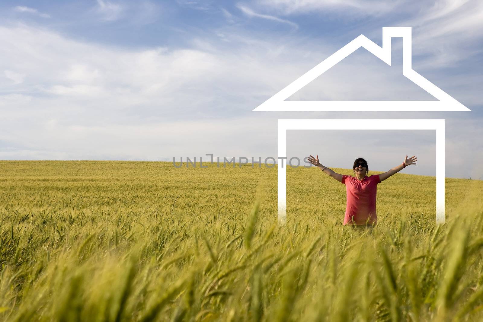 young happy woman in the middle of the field enjoying new house by mlopes