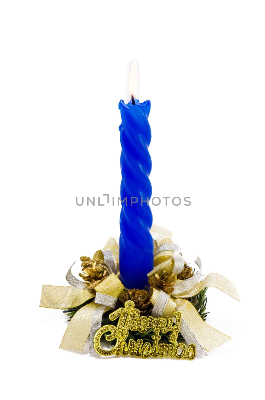 A blue Christmas candle decorated with candlestick and ribbons