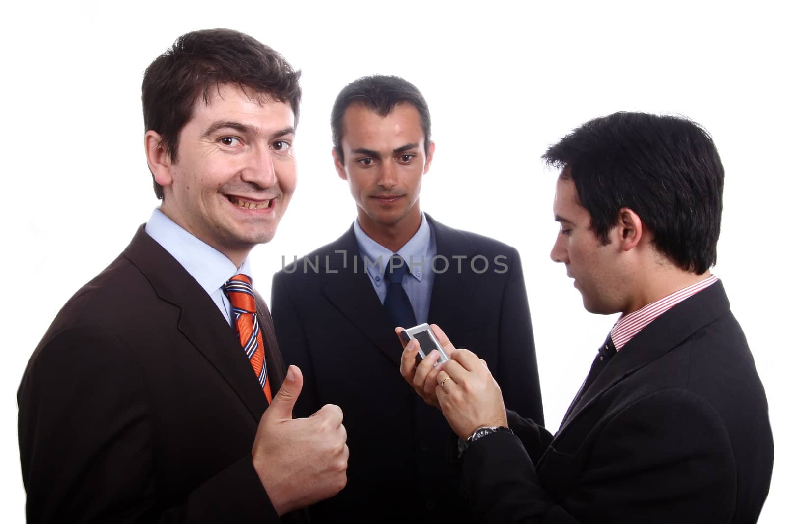 Three young business men portrait on white. focus on the left man

