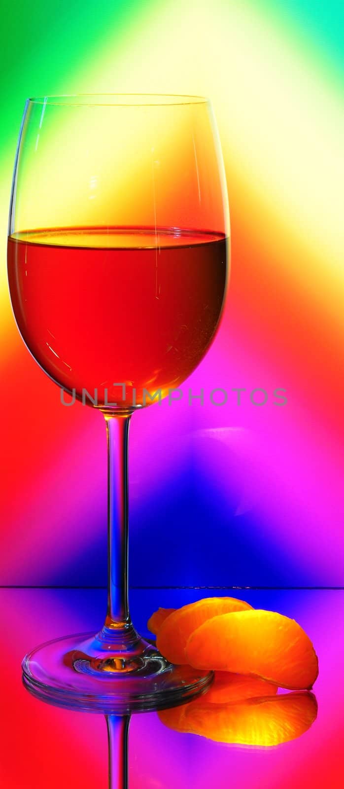 Elegant Tall Wineglass For Red Wine And Segments Of Mandarin  Over Motley  Background.