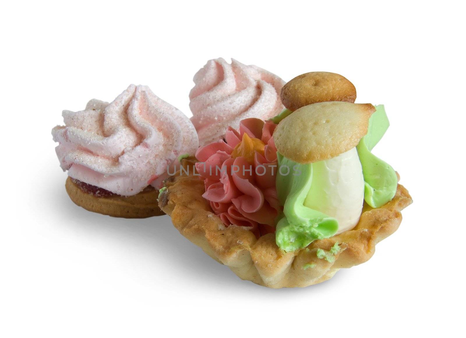 Biscuit cakes with an oil cream on white. Isolated