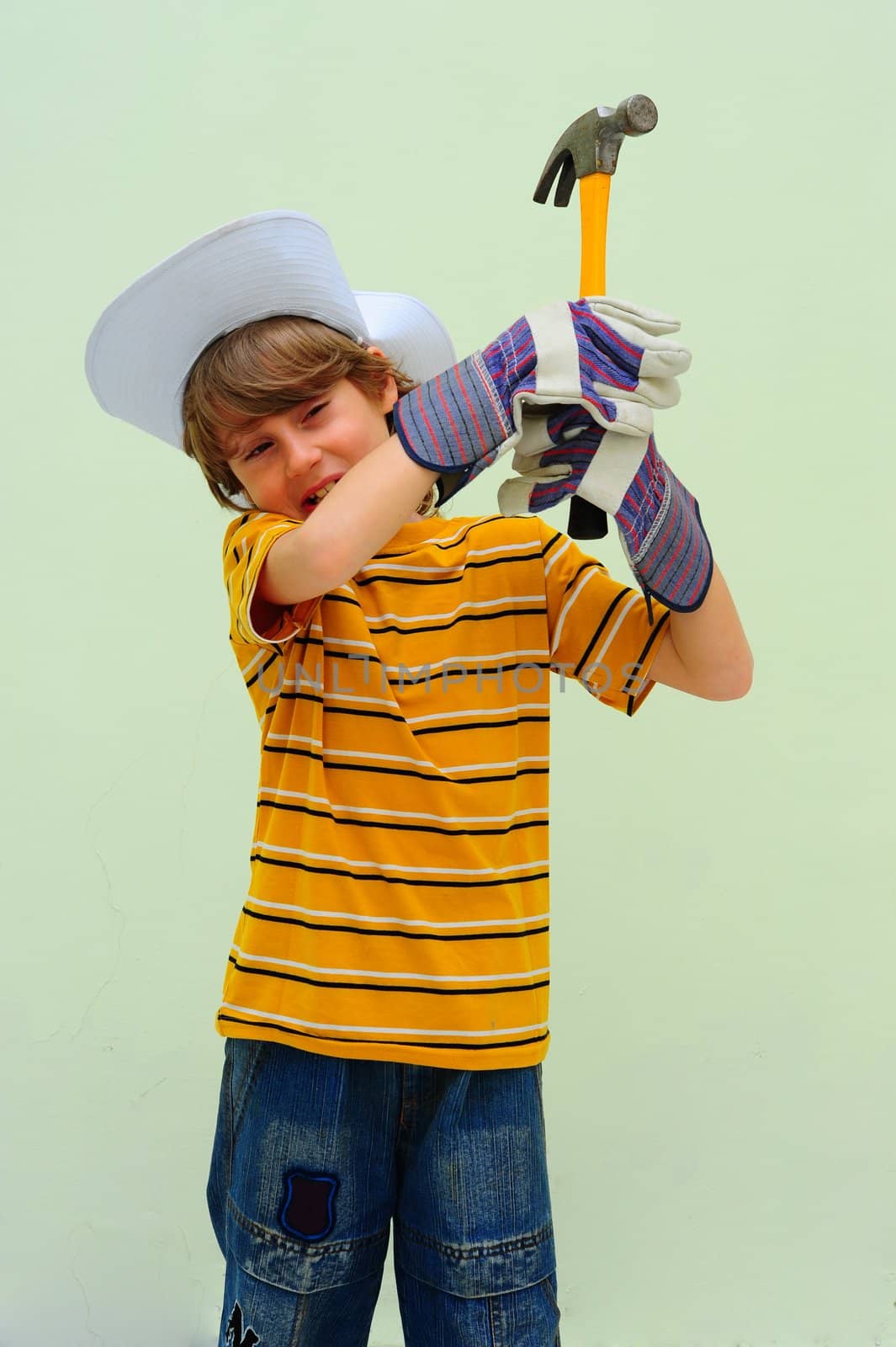 Teen Holding Steel Hammer With Wooden Handle