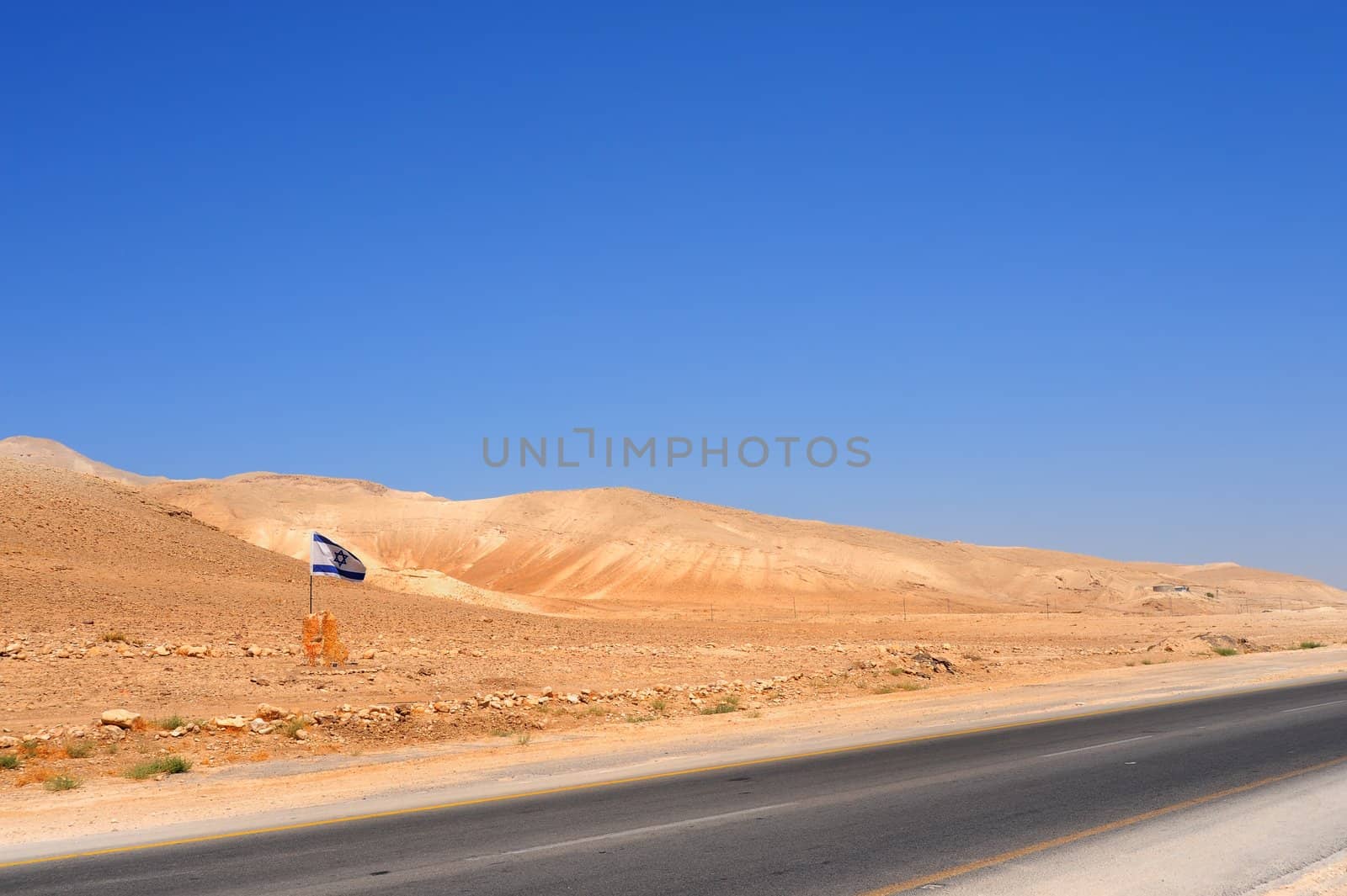 Israel Flag Near Empty Highway In Jordan Valley.