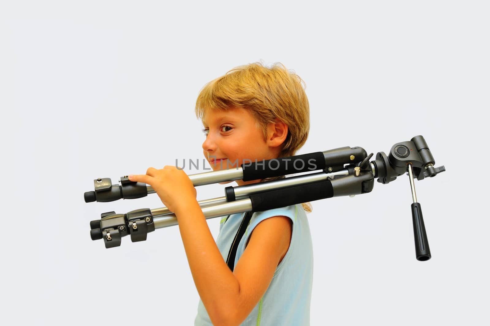 Lovely Young Photographer With Tripod Against White Background