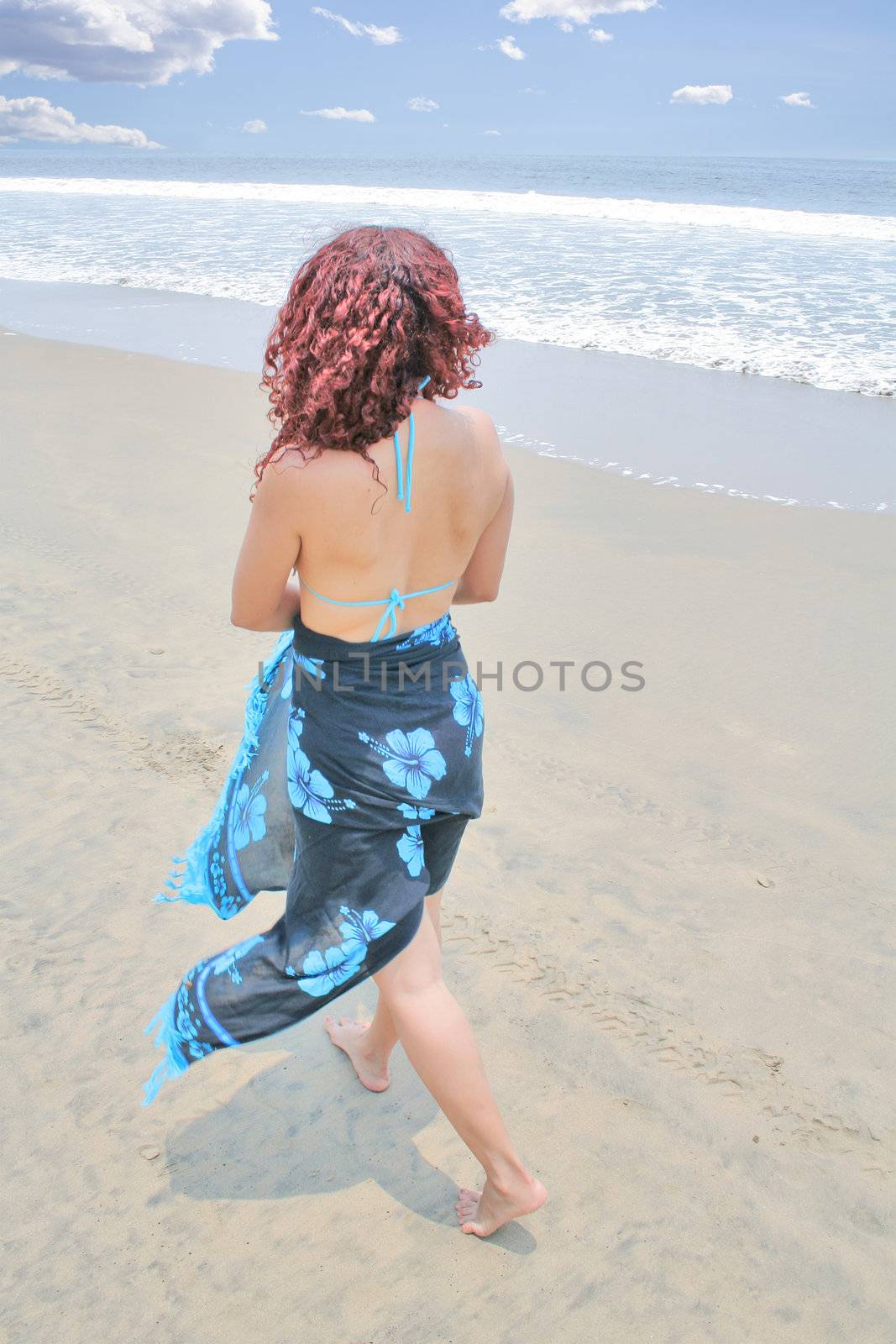 young woman enjoying time on the beach