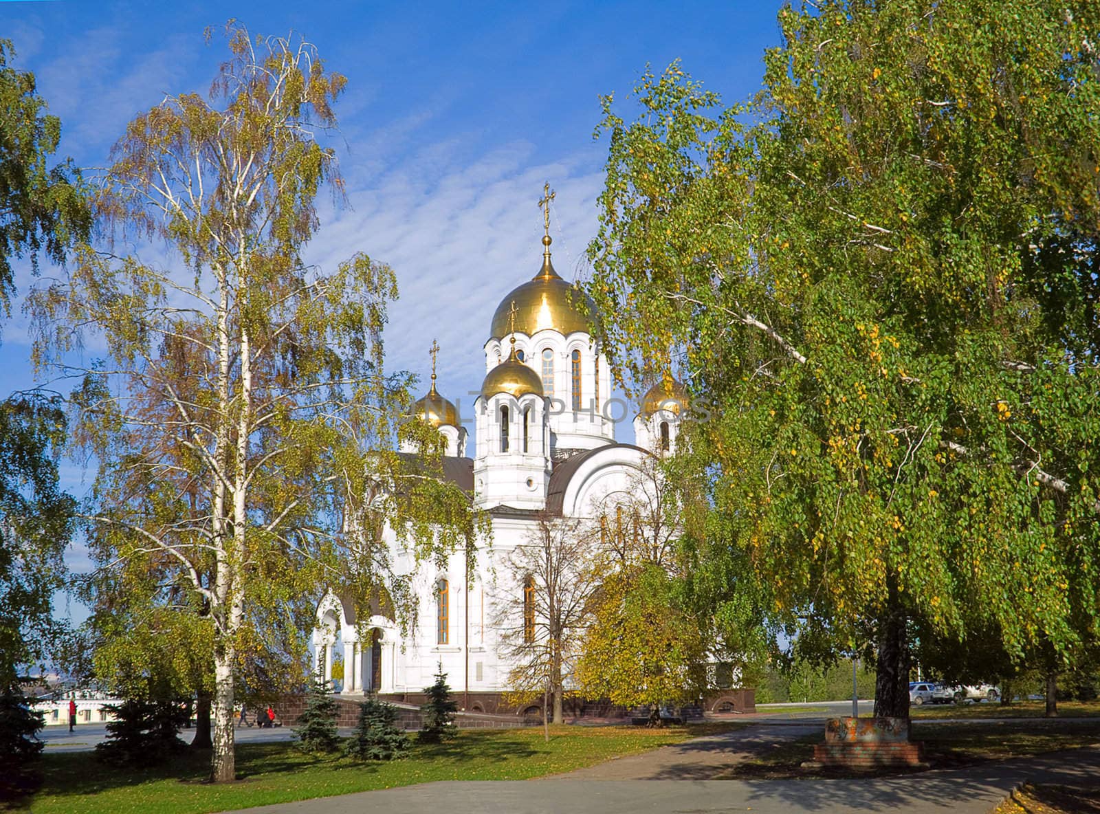 Fine orthodox church among turning yellow trees
