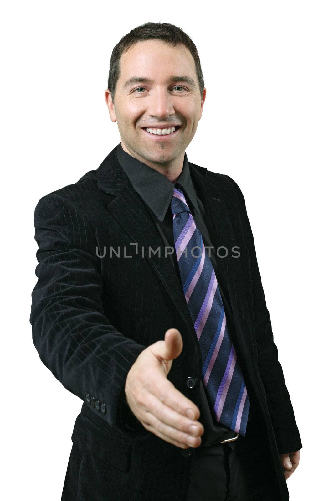 An attractive businessman in his thirties extending his hand out for a handshake.
