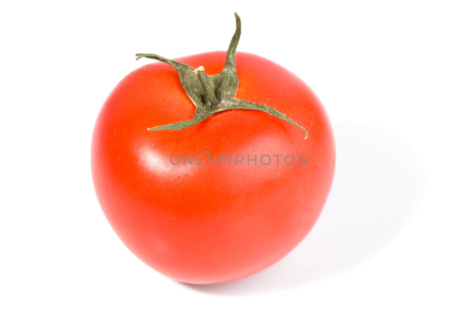 Single red tomato isolated on white background