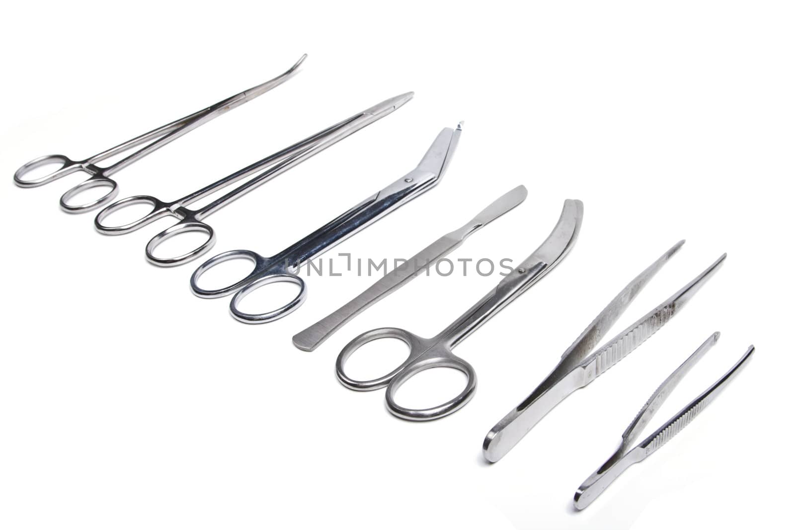 Surgical tools - scalpel, forceps, clamps, scissors - isolated on white background