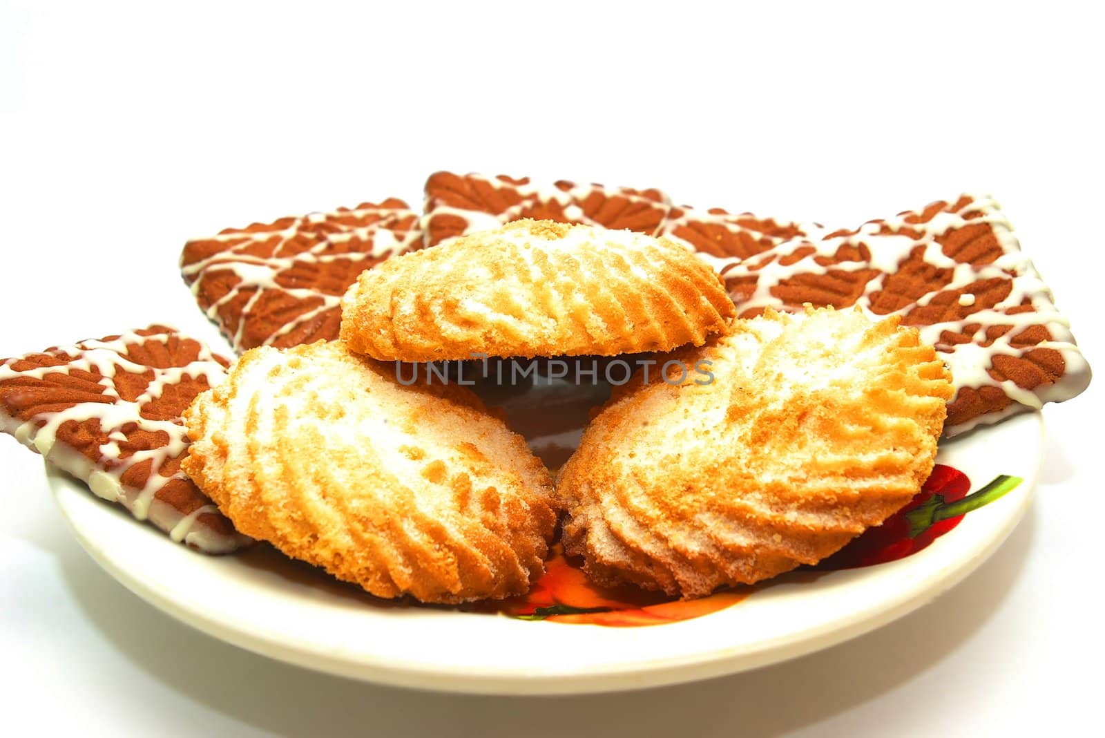 Photo of the plate with cookies on white background
