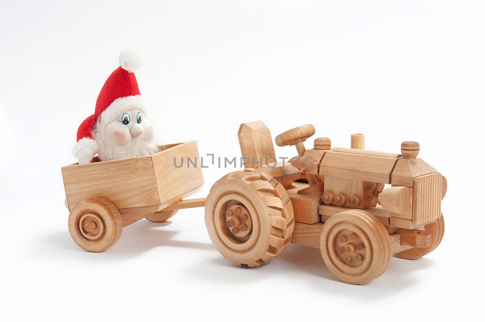 Christmas present with toy tractor and gnome in trailer