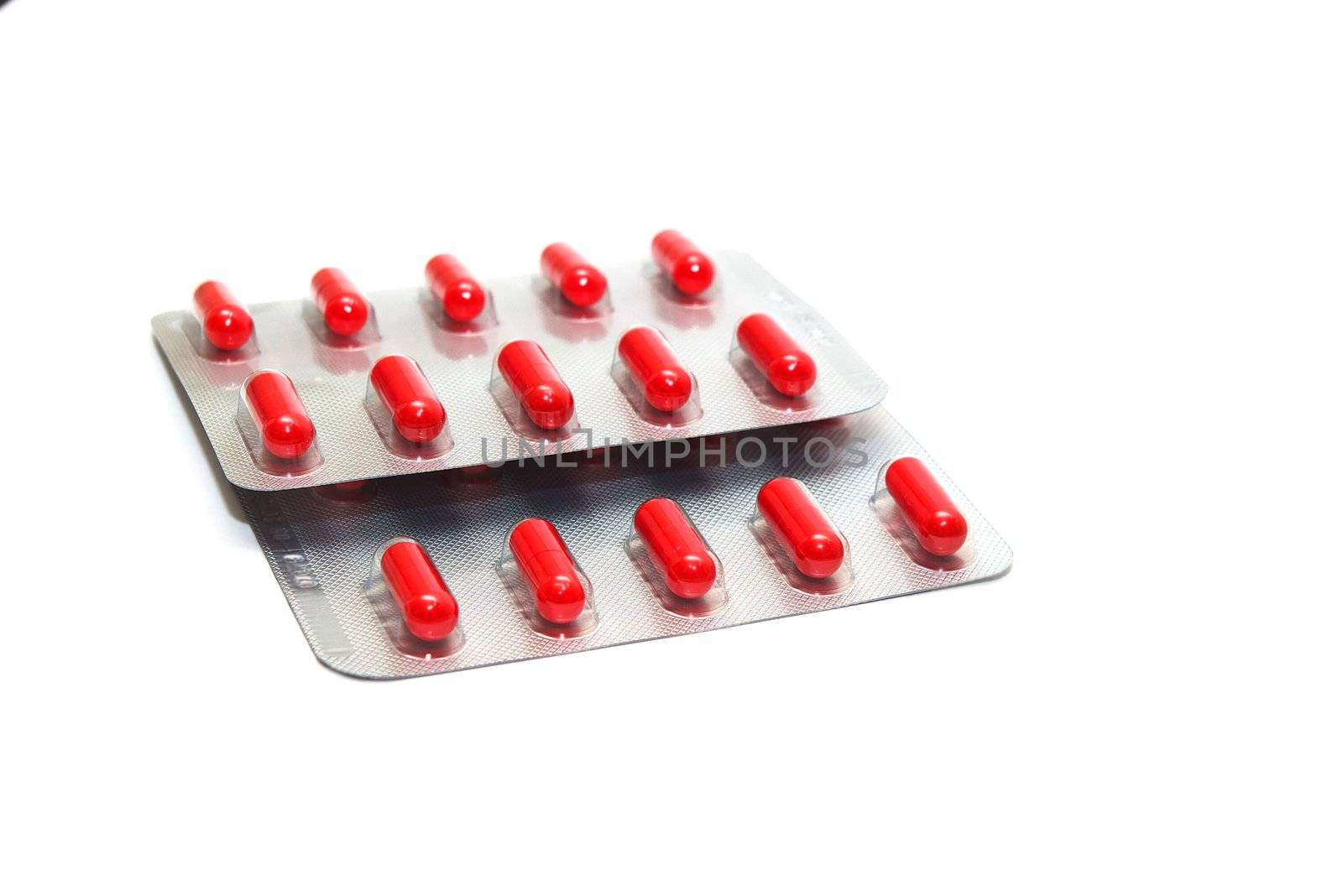 photo of the packings of pills on white background