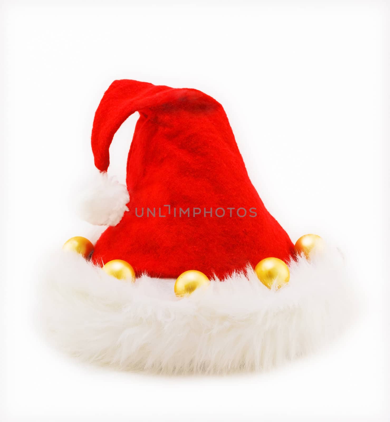 Red Christmas hat made of wool with yellow balls on white