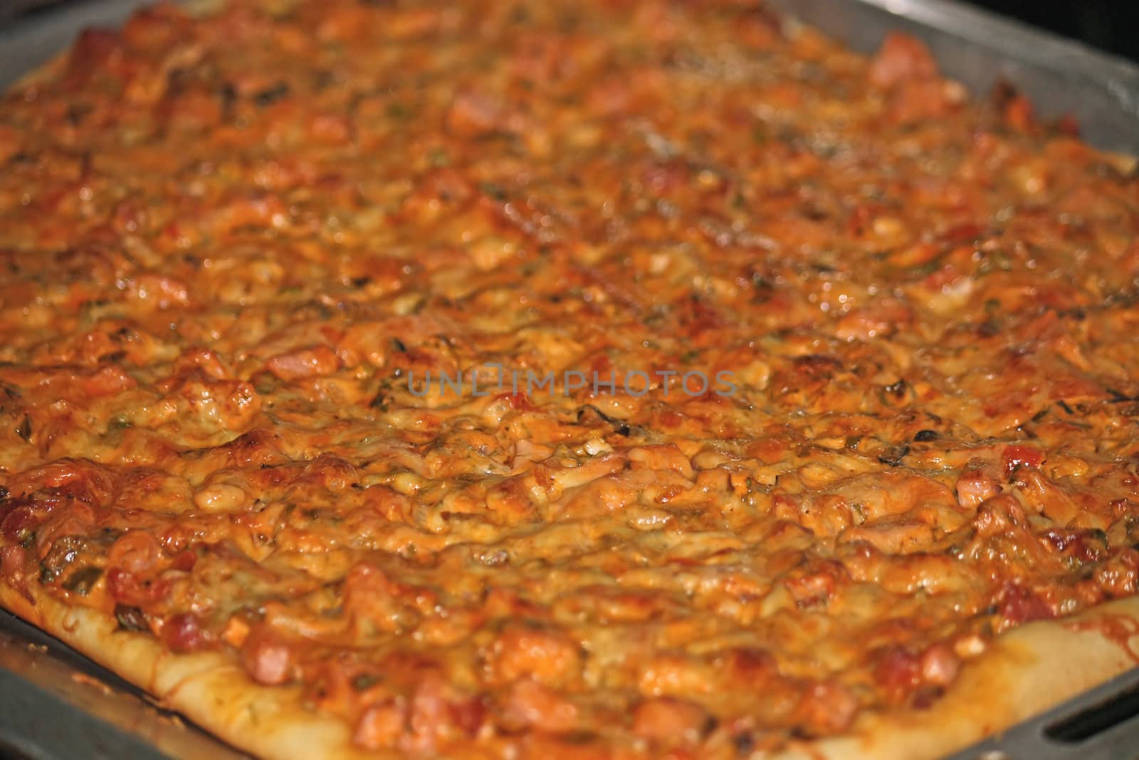 Thin layer of the test and thick layer of stuffing. It is very tasty pizza.