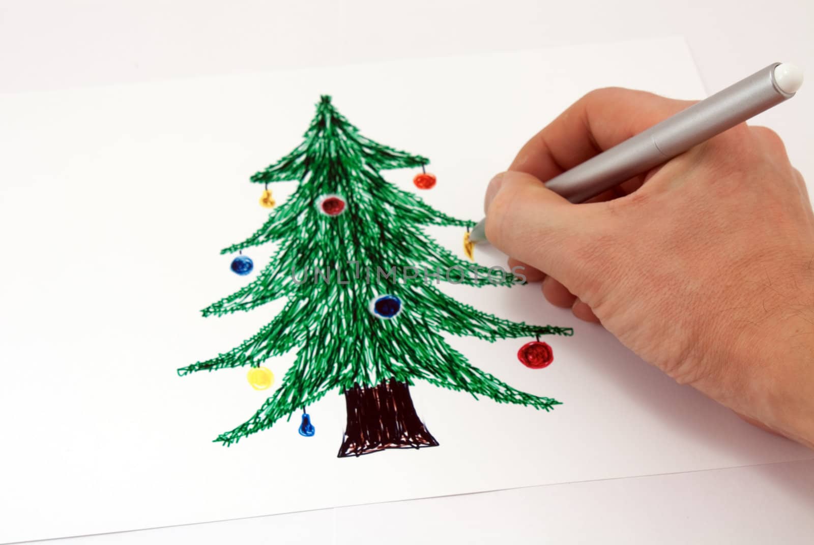 Drawing a Christmas tree markers on paper