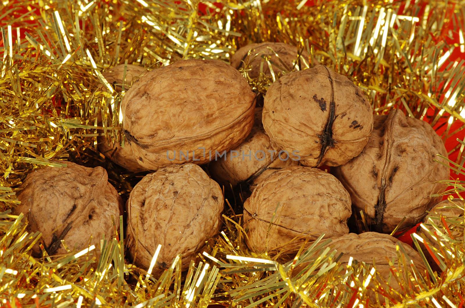 Christmas nuts heap decoration with golden ribbon