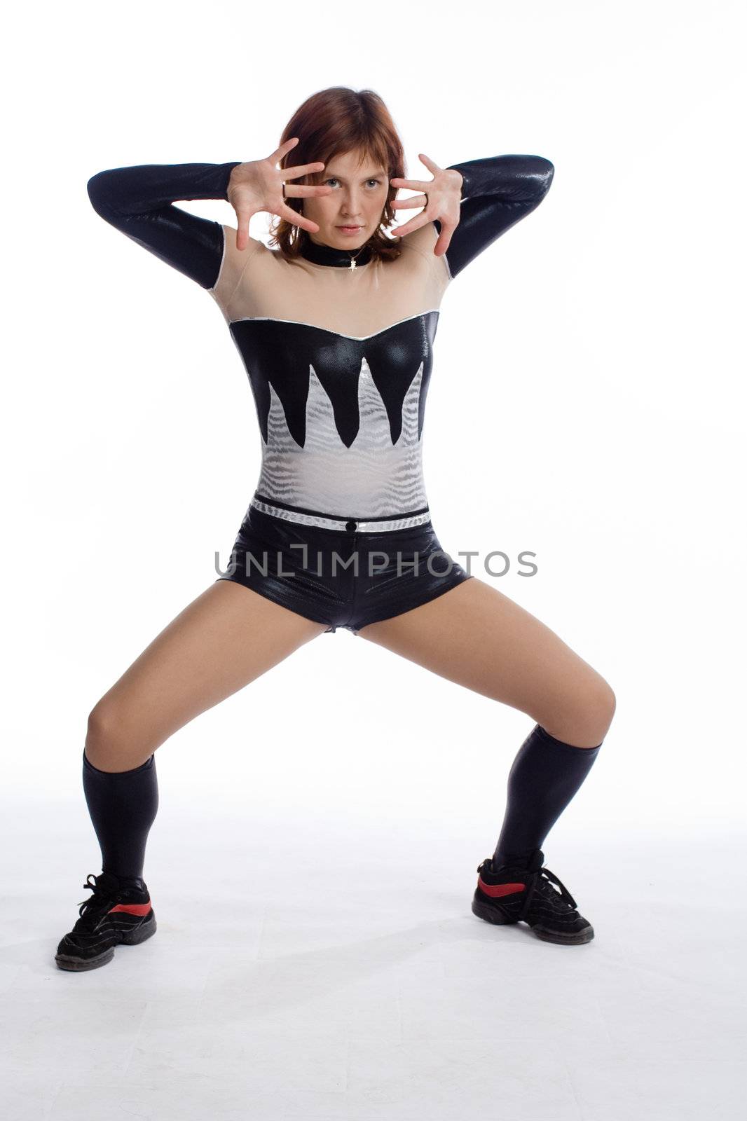 young girl in balck and white stage costume on white
