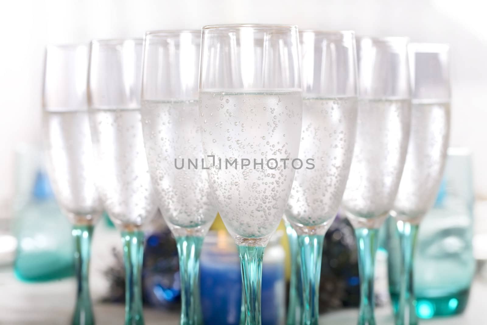 Flute wine glasses with bubbly drink by jarenwicklund