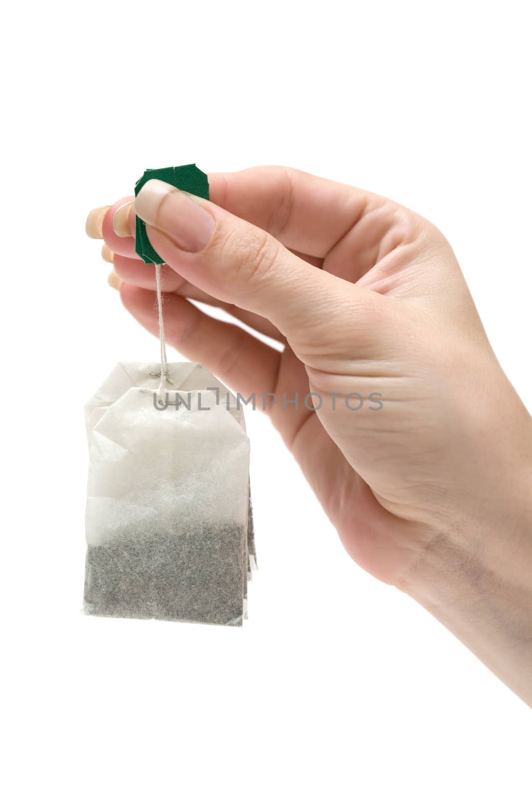 Woman holding two tea bags. Isolated on a white background.