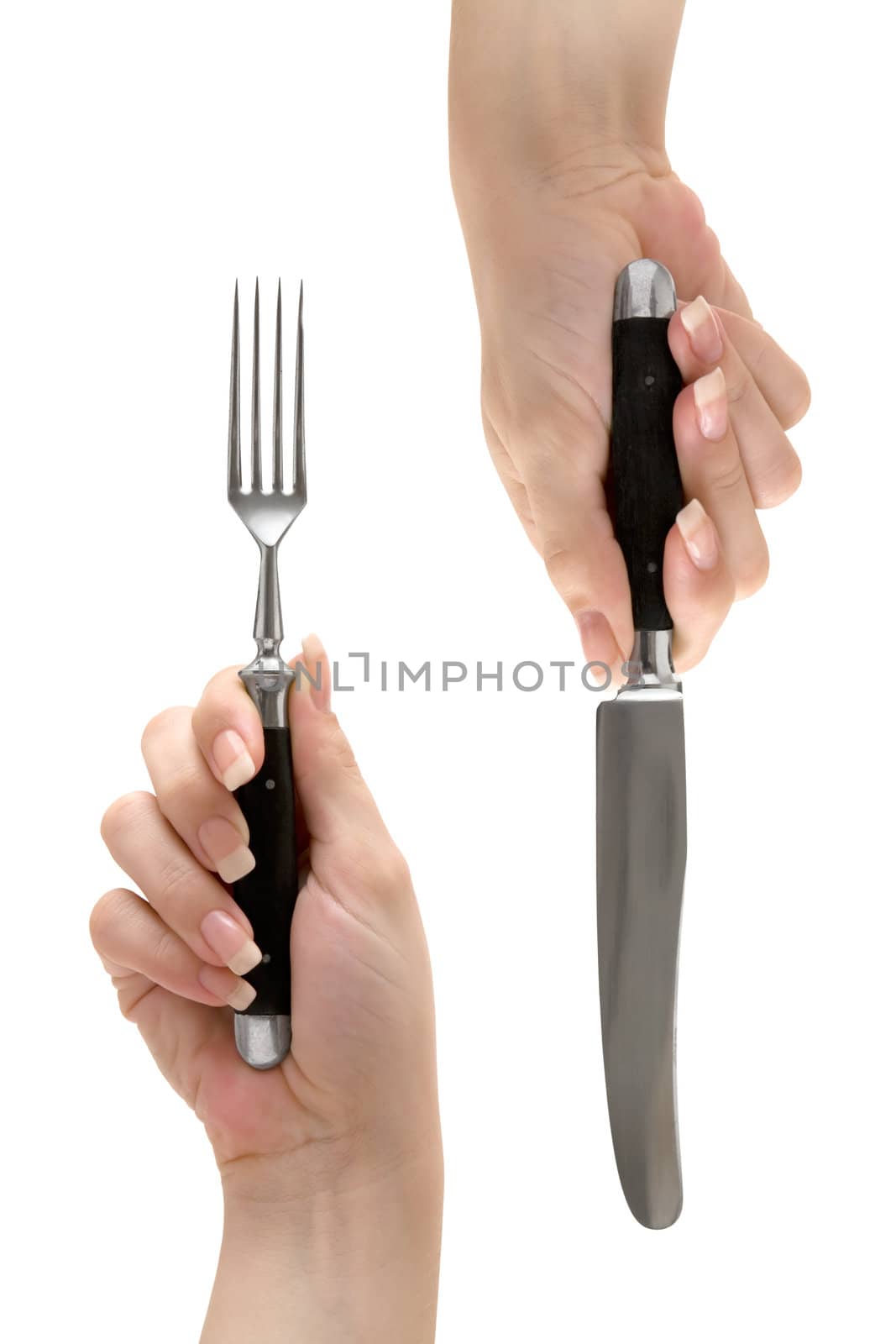 Female hands holding fork and knife. Isolated on a white background.