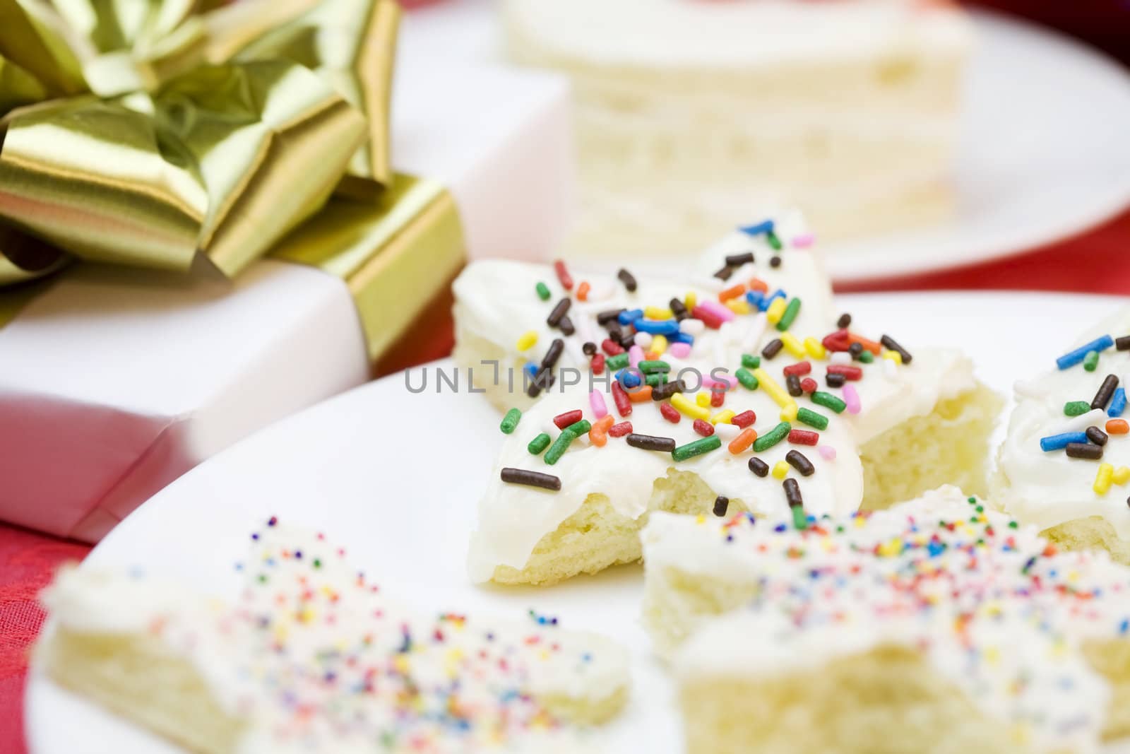 Frosted cake pieces with sprinkles