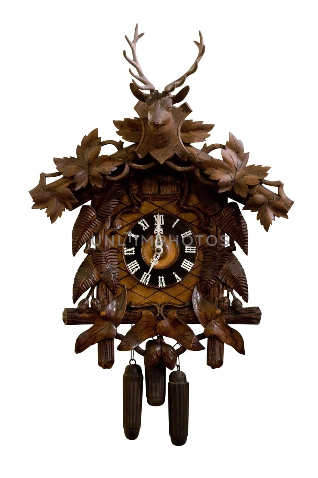 Old wooden cuckoo clock isolated on a white background.