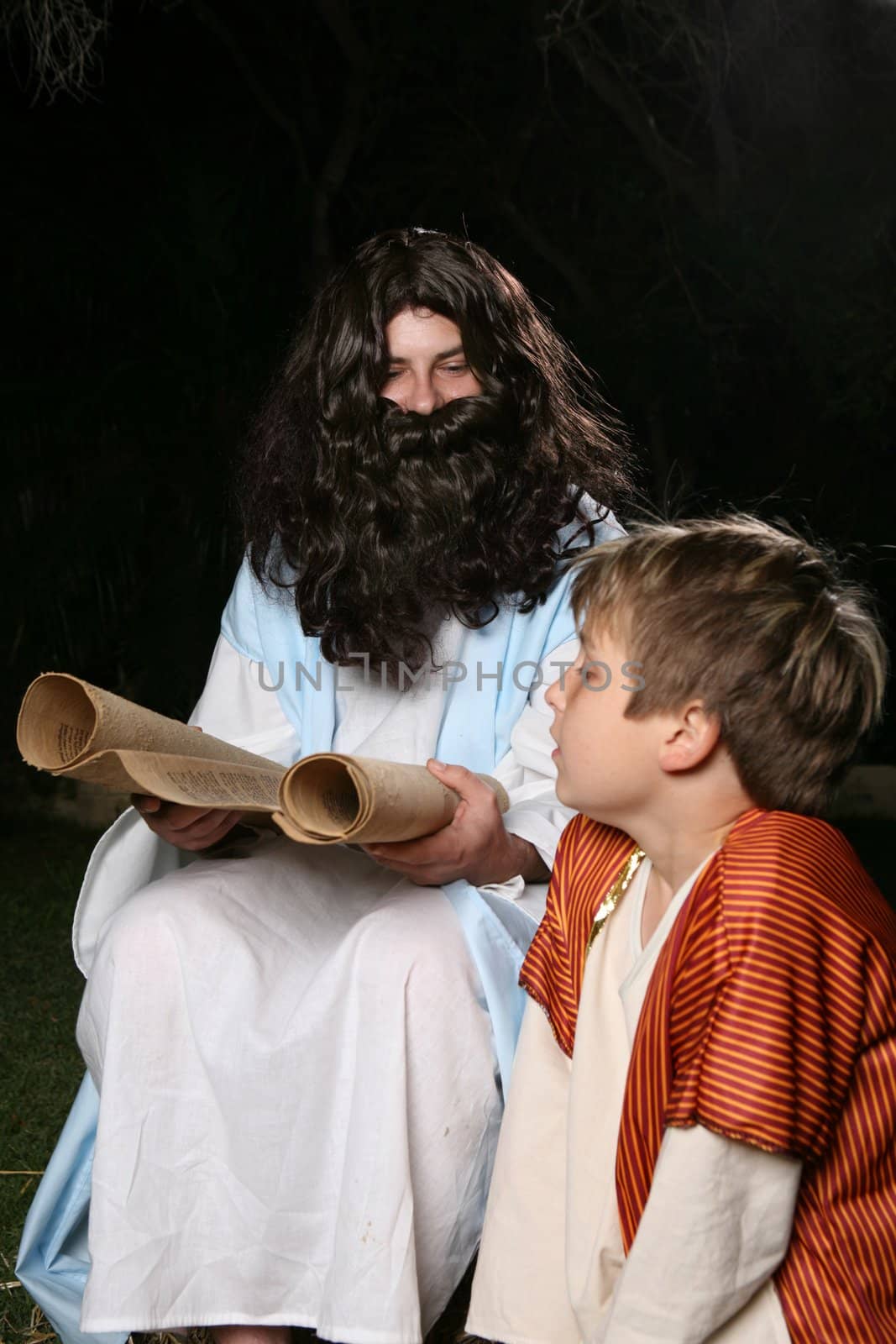Jesus with a child or other biblical man (eg Elijah the prophet teaching Samuel)  reading and teaching the scriptures to an attentive child.  