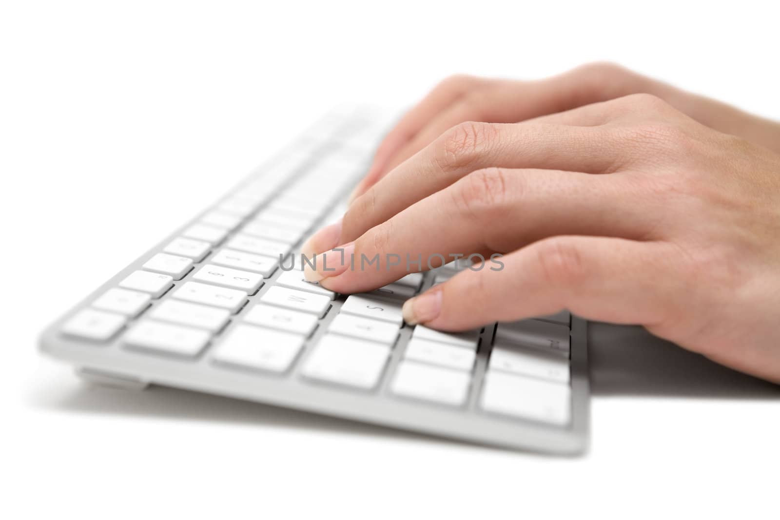Woman typing on a modern keyboard. White background.