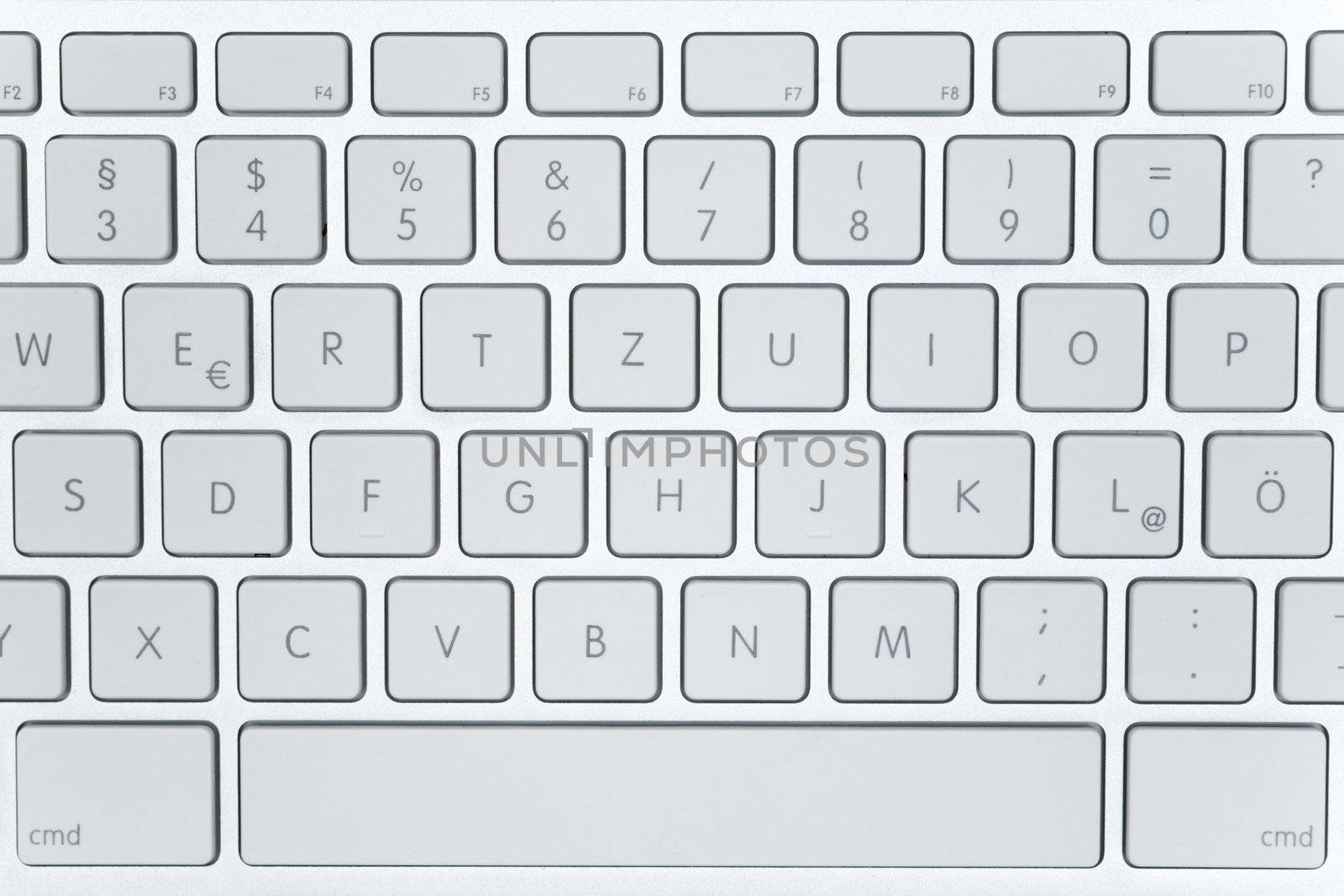 Top view on a white computer keyboard.