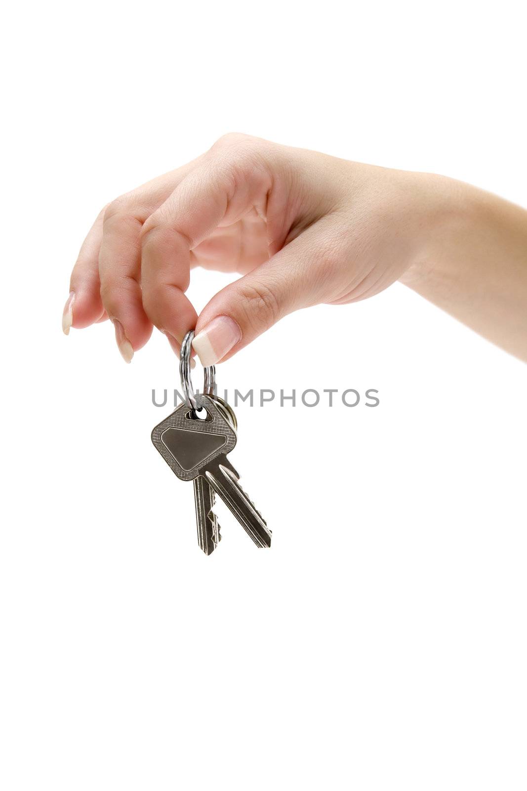 Female hand holding keys. Isolated on a white background.