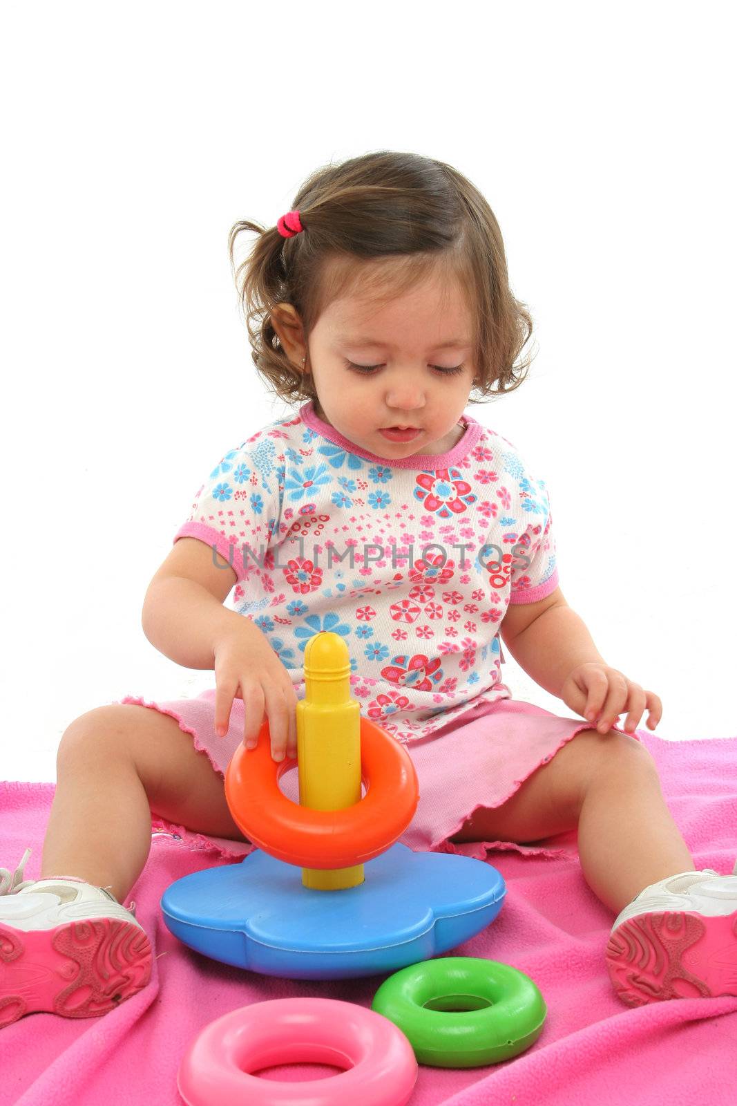 Little girl playing and having fun with generic toy. More pictures of this baby at my gallery
