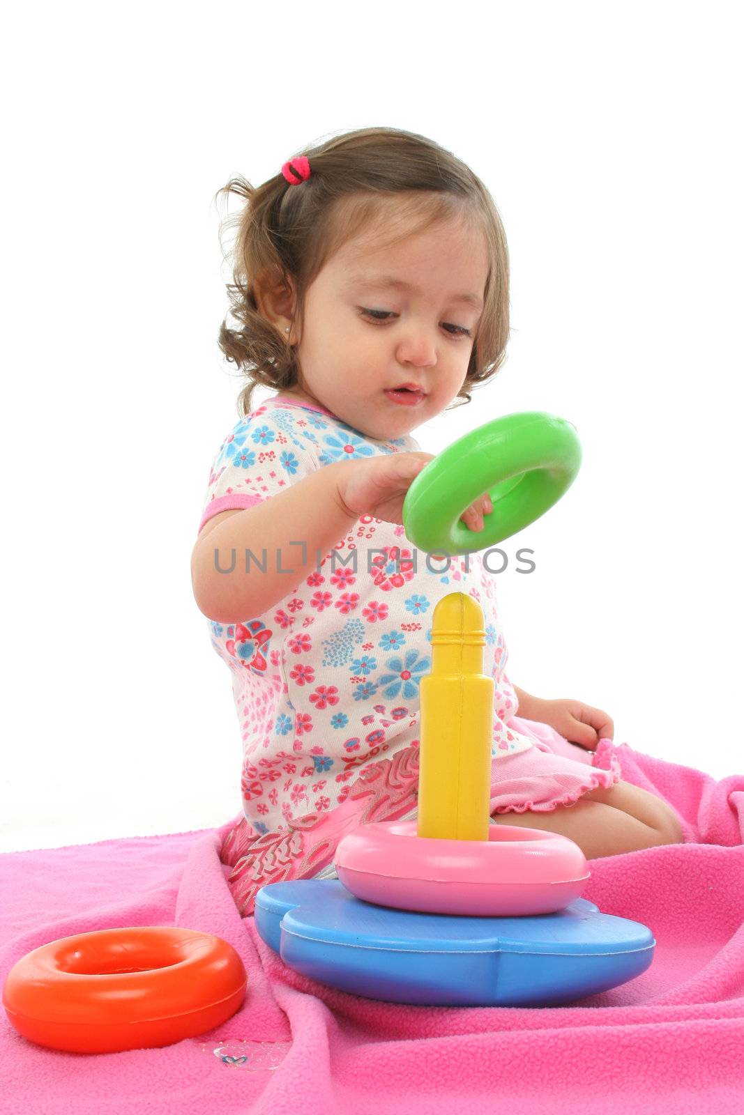 Toddler playing with generic toy by Erdosain