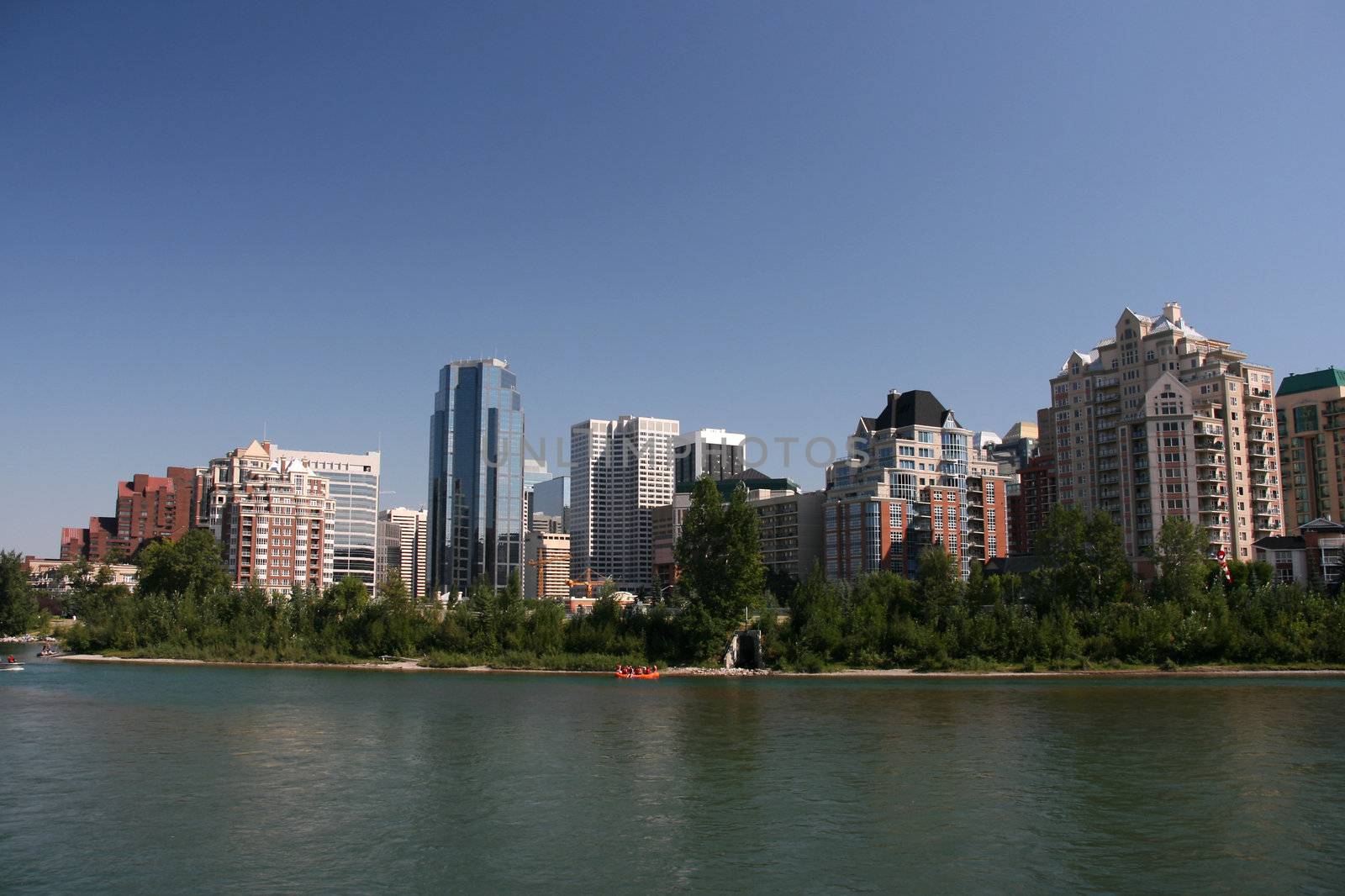Calgary downtown skyline with Bow River. Modern skyscrapers architecture.
