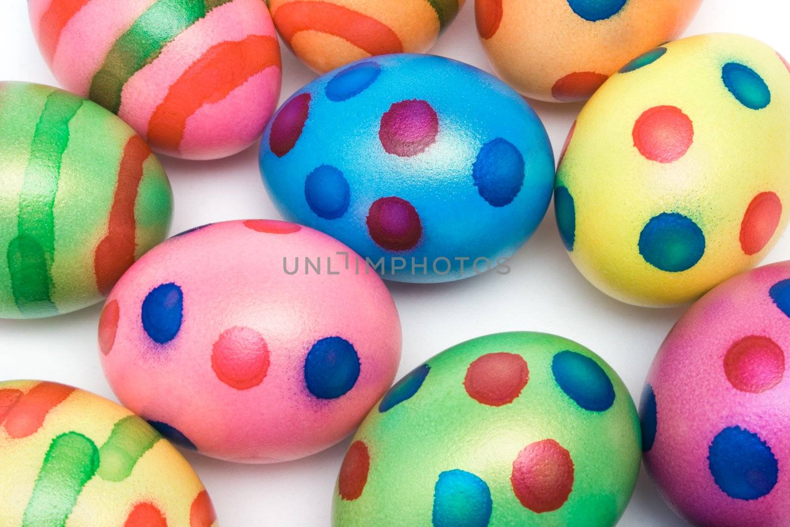 Top view on colored easter eggs isolated on a white background.