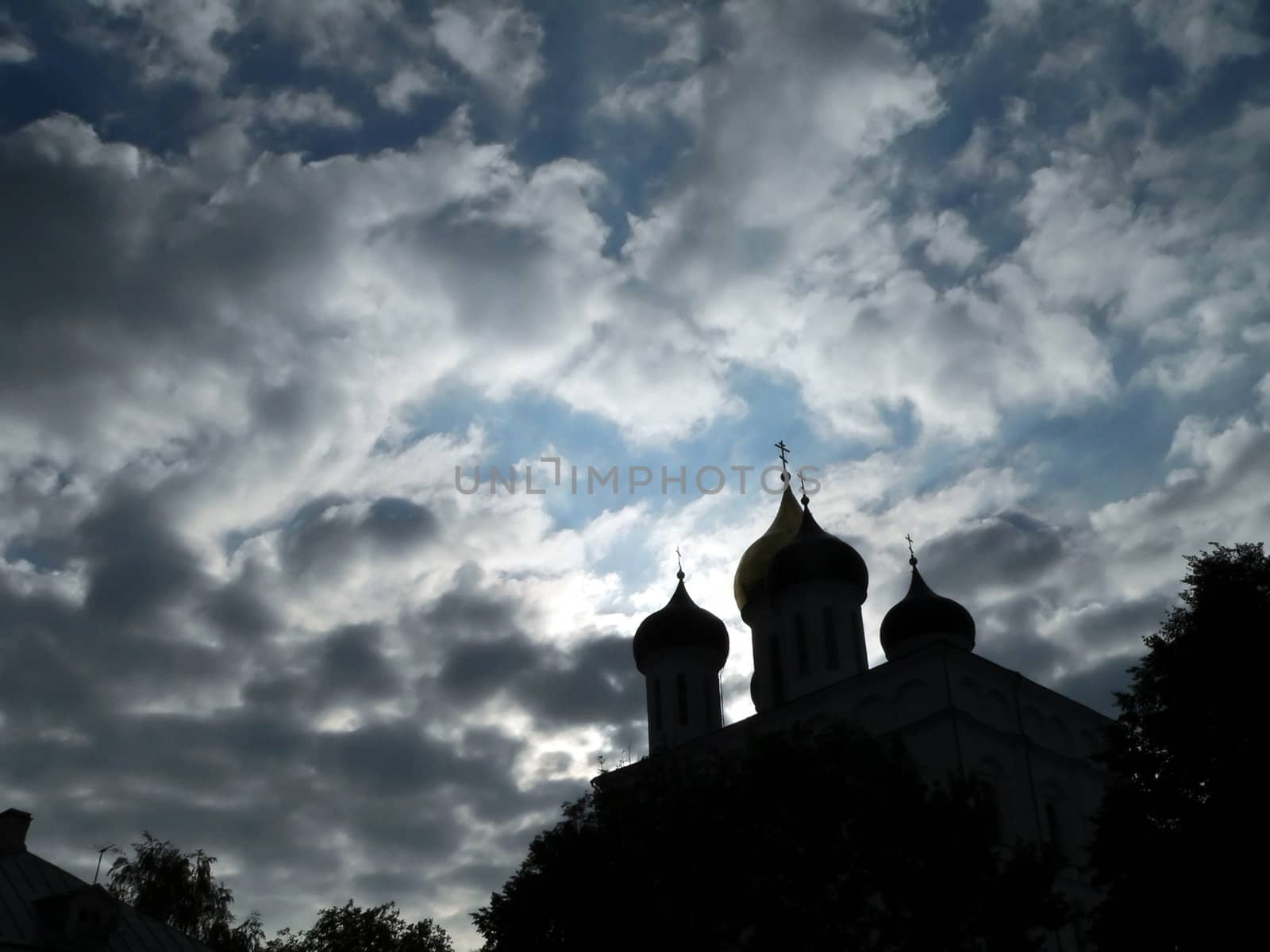 Churchs of Pskov on cloudy sky background