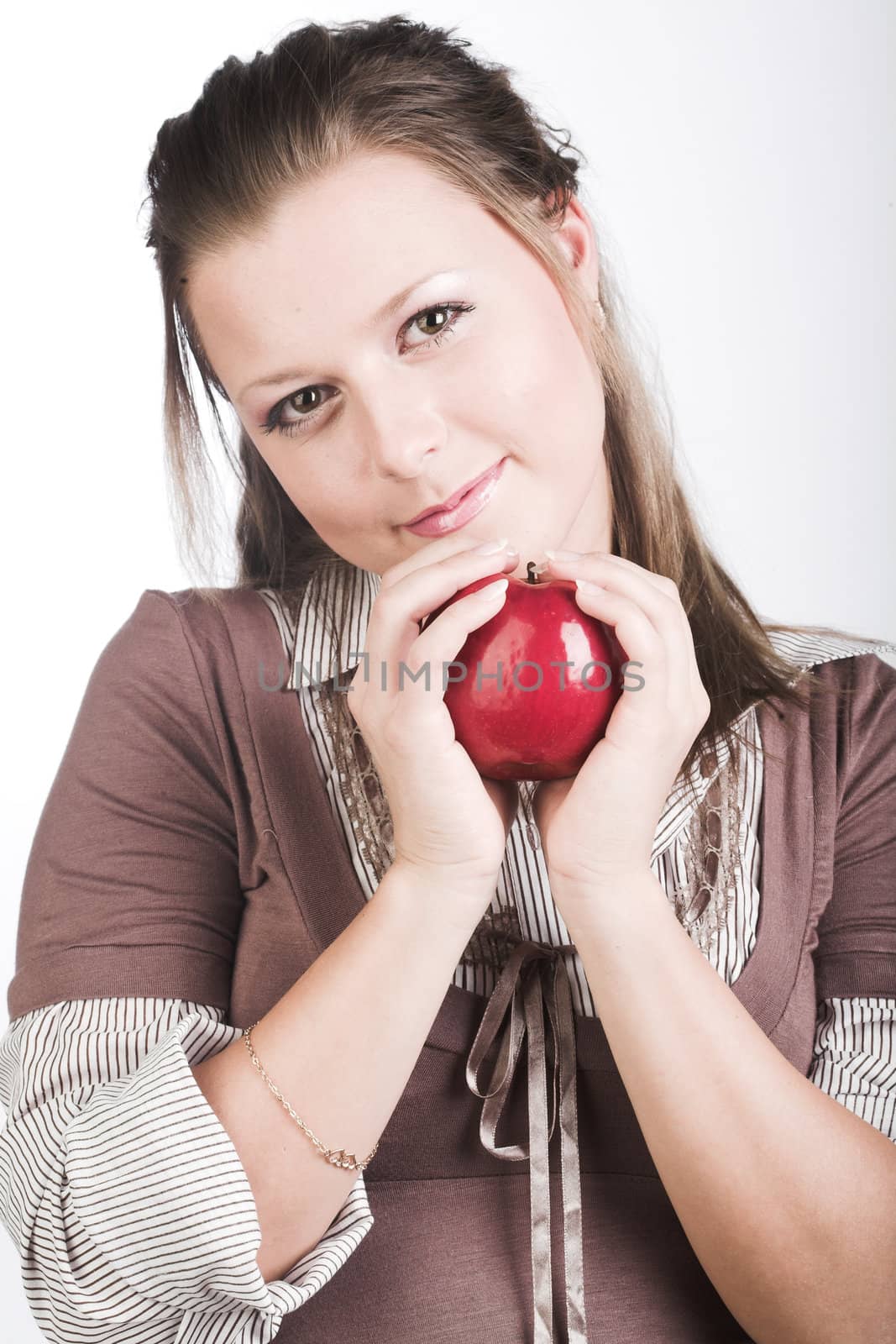  beautiful young smiling woman with red apple.
