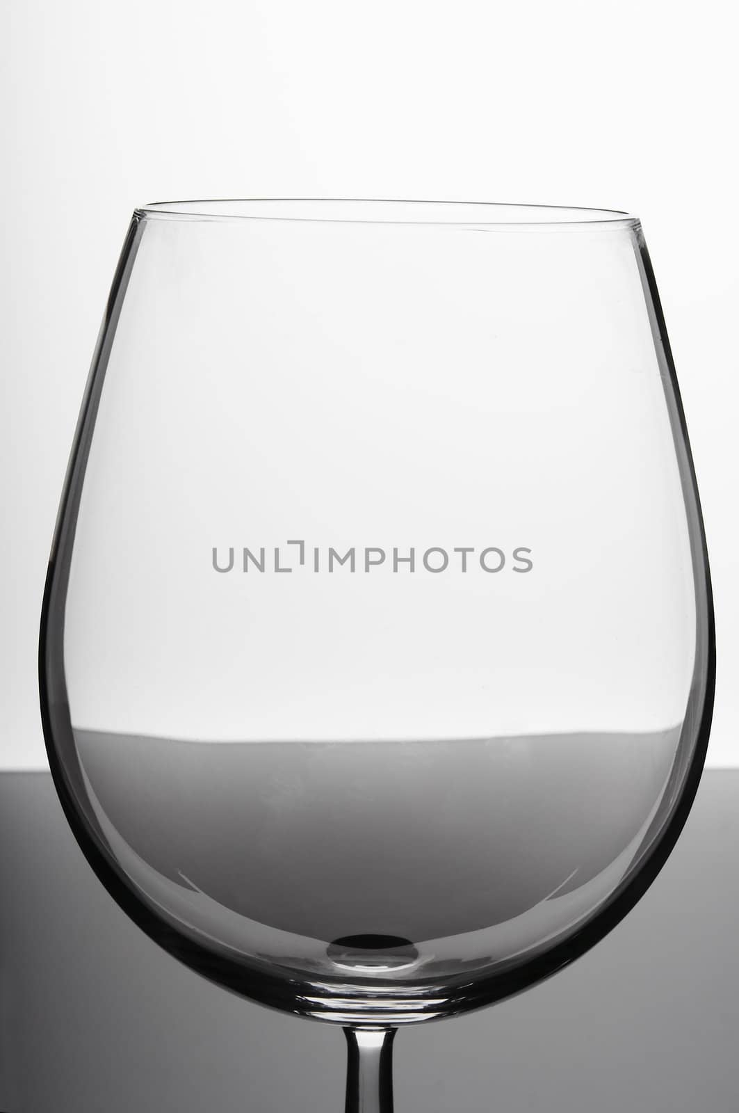 Empty wine glass on white background