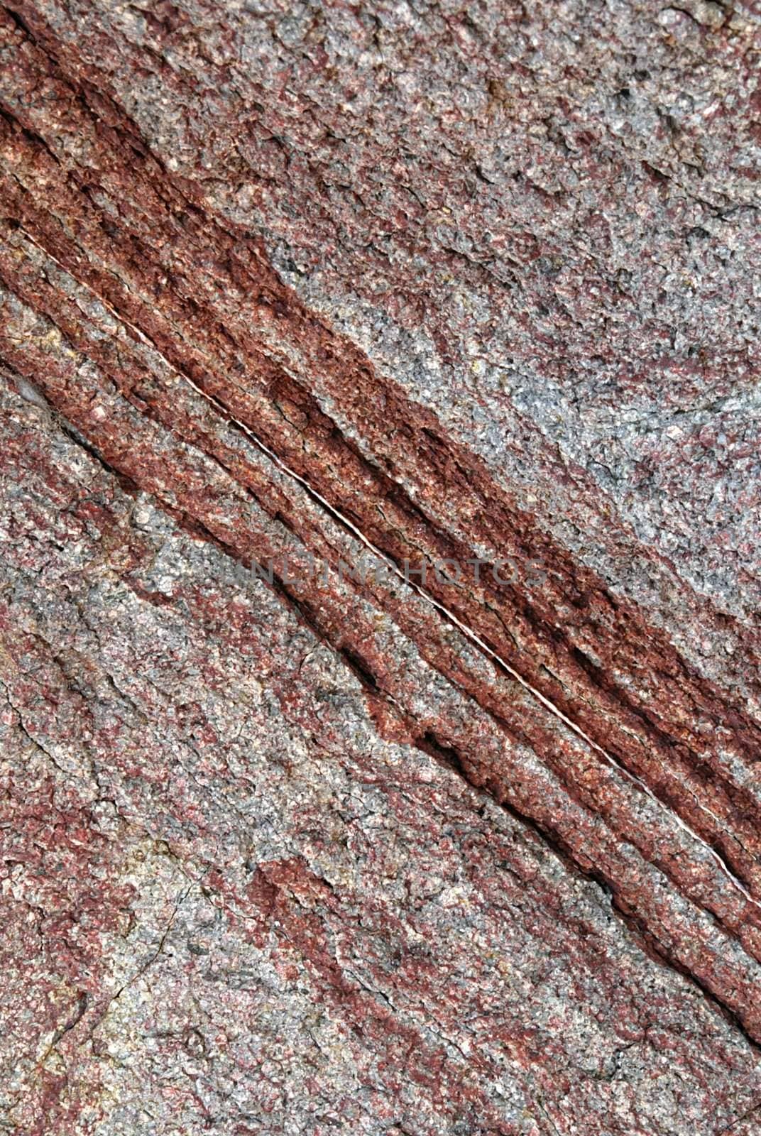 Natural stone texture with visible layers of sediment in lines