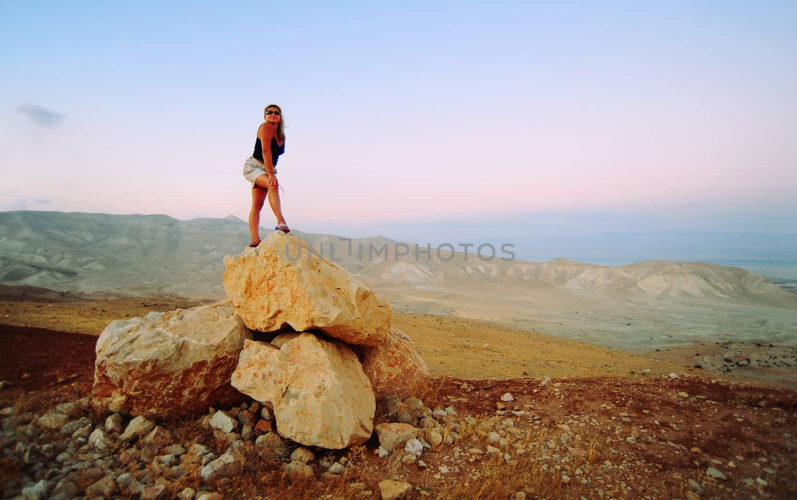 Woman Posing On The Judea Mountain Top At Sunset