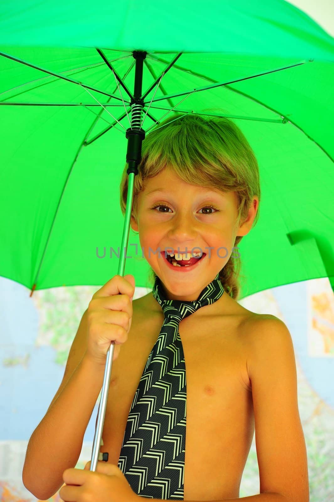 Little Boy Under Green  Umbrella At The Map.
